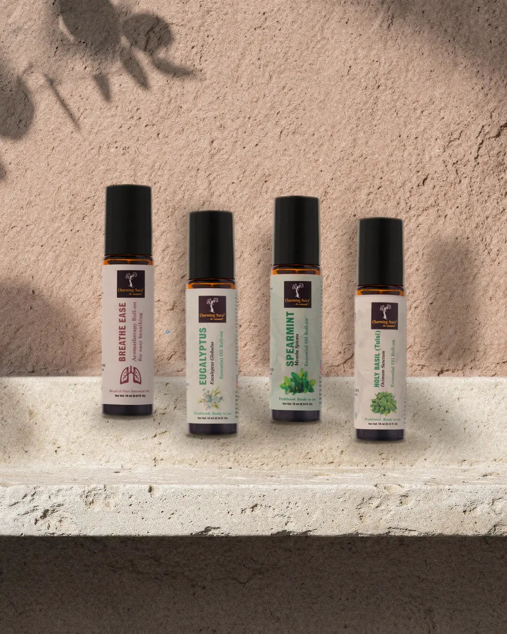 Prana, Eukalyptus, Grüne Minze und Tulsi Roll-on auf einer Putzkante